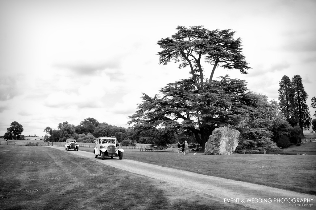 Black and white shot of two vintage Rolls Royce cars arriving for a Compton Verney wedding