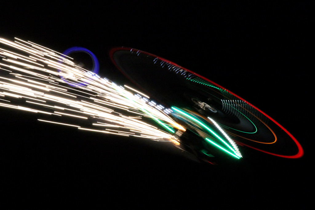 Many of the remote-controlled helicopters literally charged around the night sky.