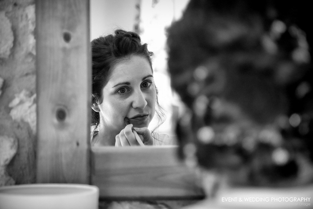 Louise applies her wedding day make-up ahead of her Huntsmill Farm wedding