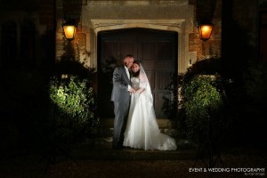 Making use of the venue's architecture after the sun has set - by Northamptonshire wedding photographer Karl Drage