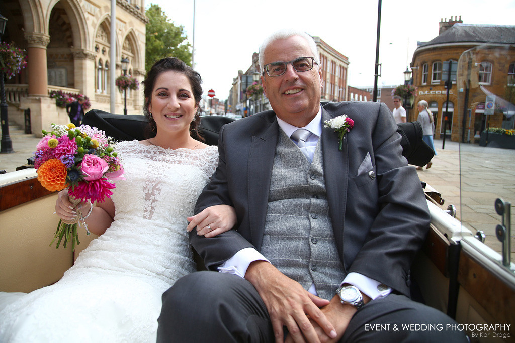 The bride and father-of-the-bride arrive at Northampton Guildhall - by Northampton wedding photographer Karl Drage
