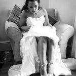 The bride checks her footwear prior to her wedding ceremony