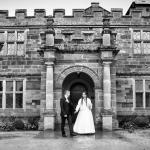 Bride and groom in front of Delapre Abbey.