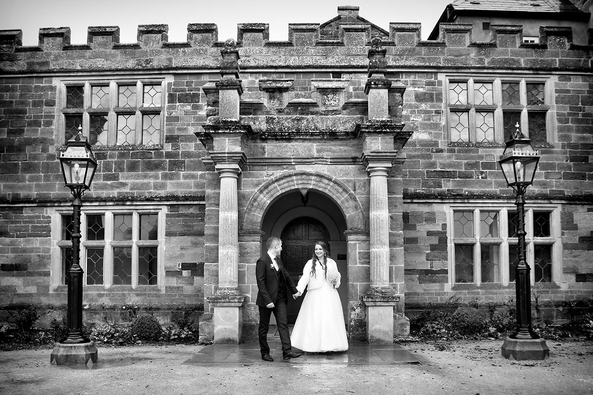 Bride and groom in front of Delapre Abbey.