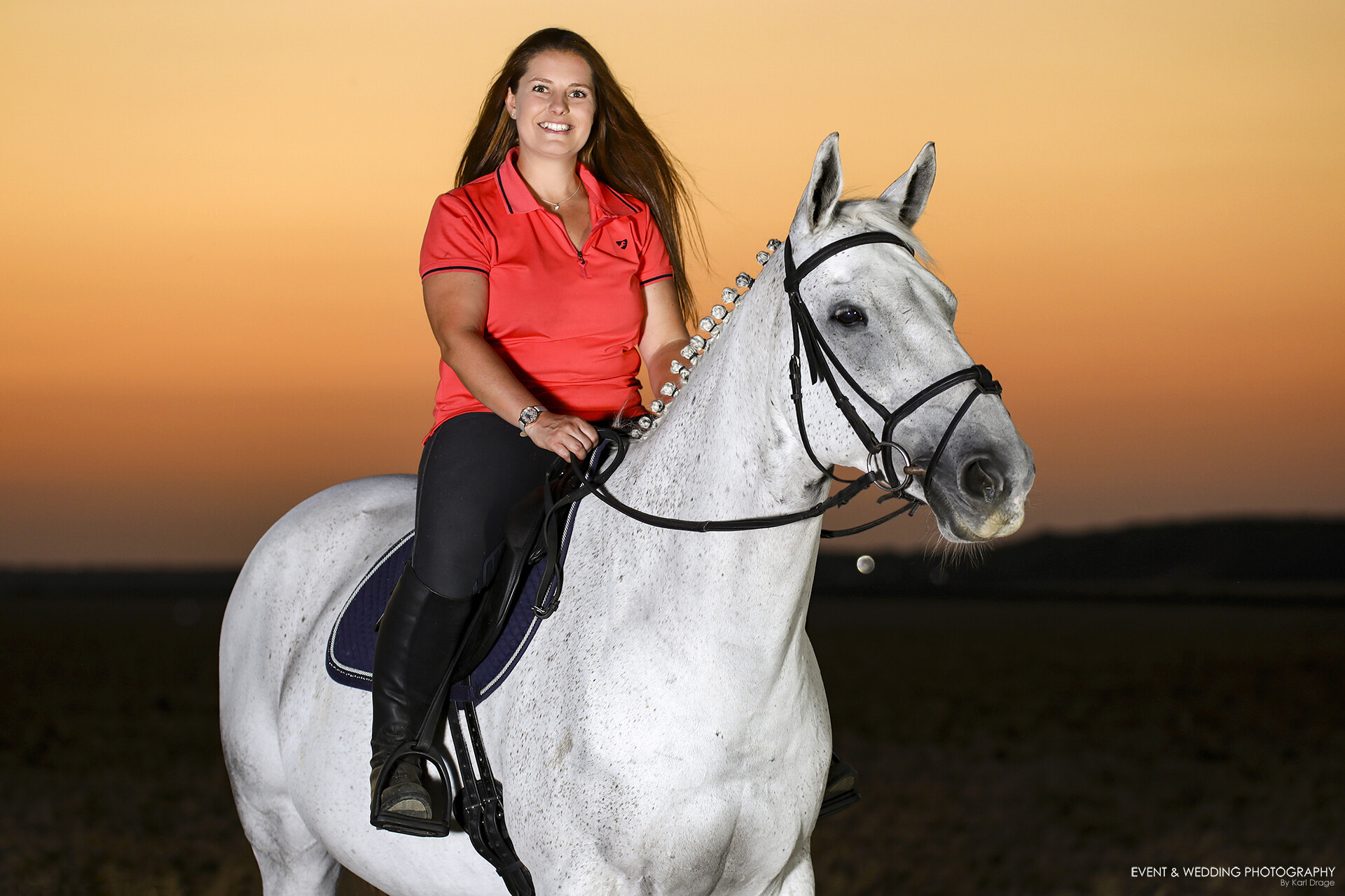 Studio lights used to illuminate horse and rider after the sun has set