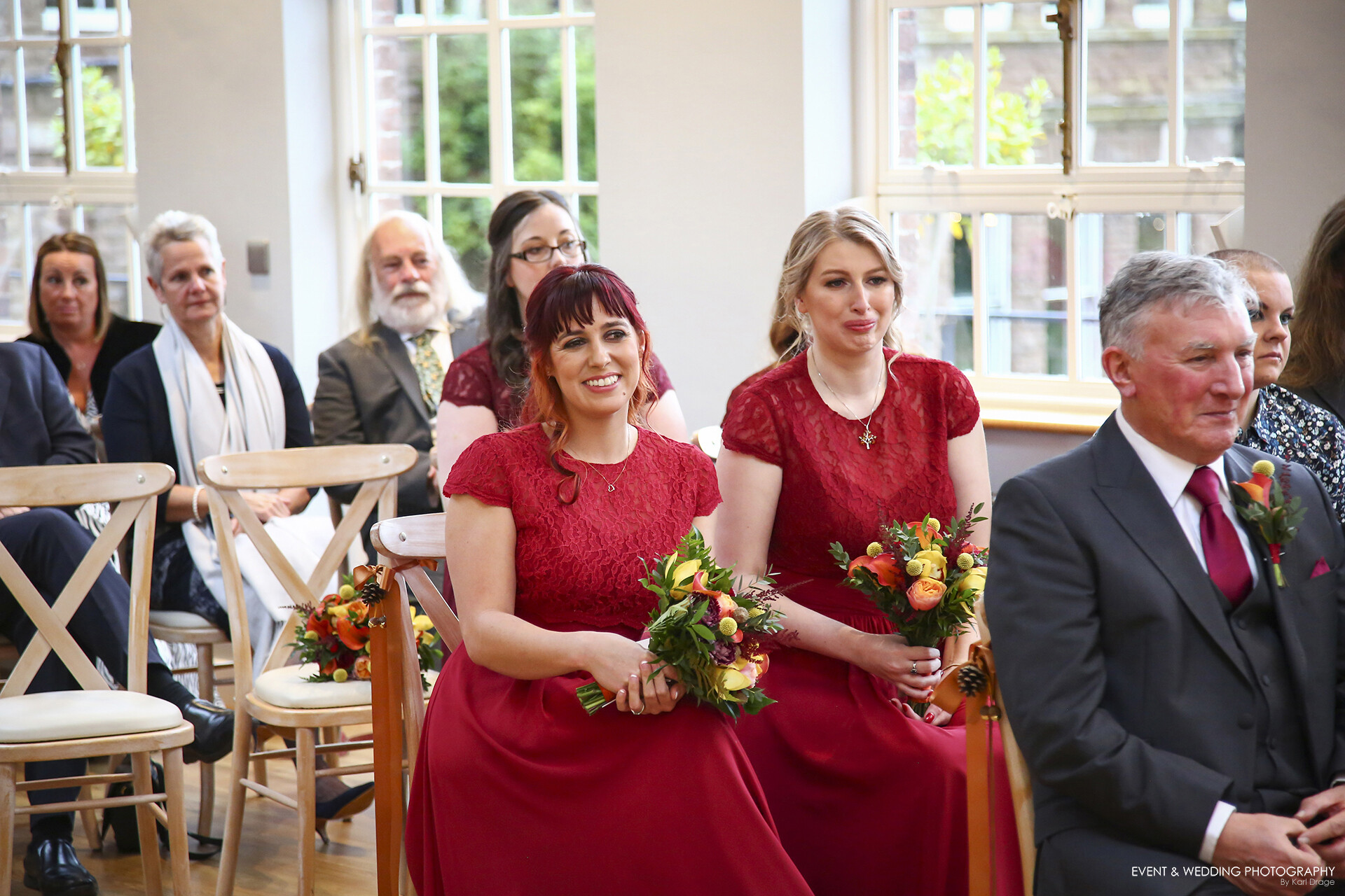 Guests look on intently during a wedding ceremony