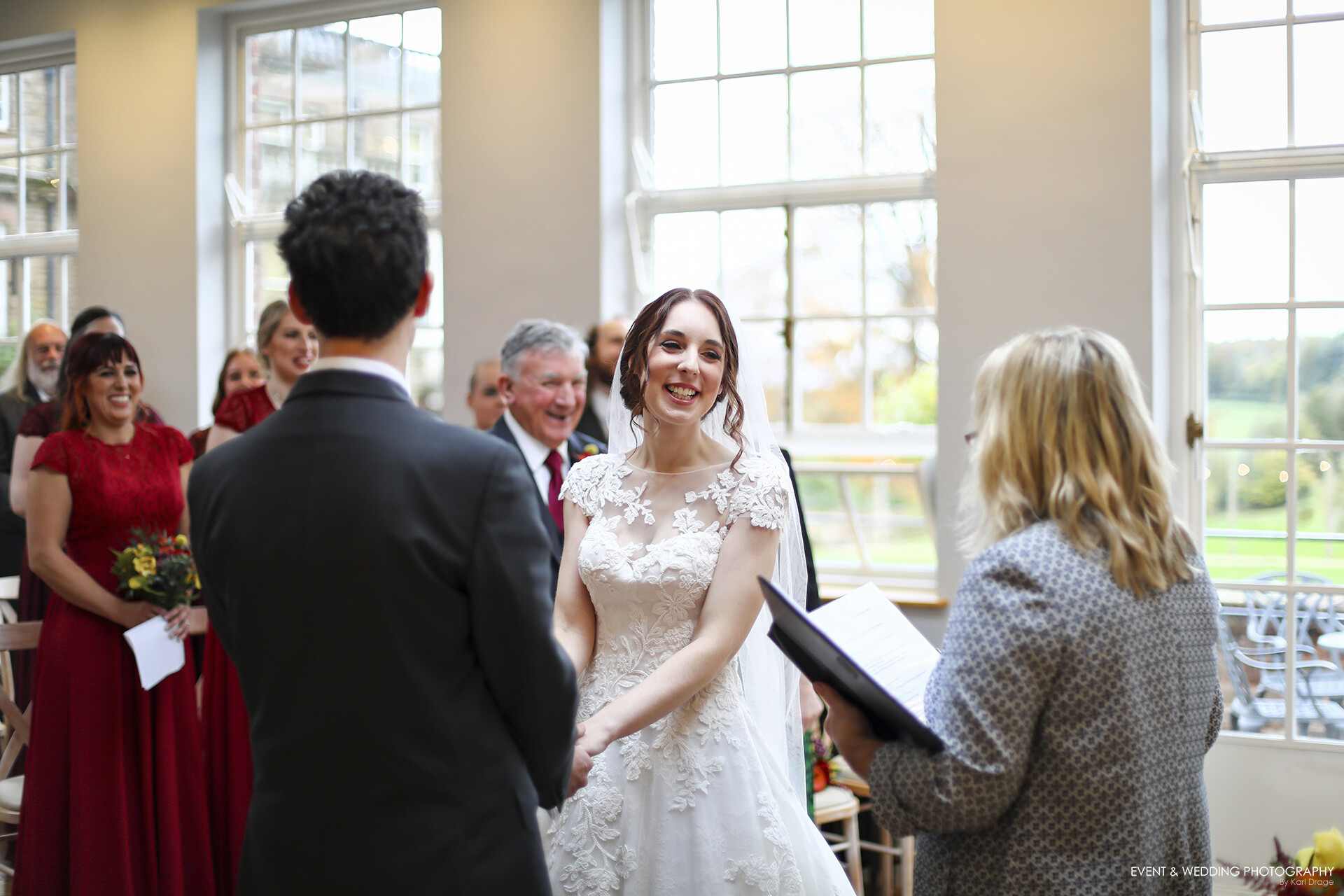 The Bride laughs during her wedding ceremony