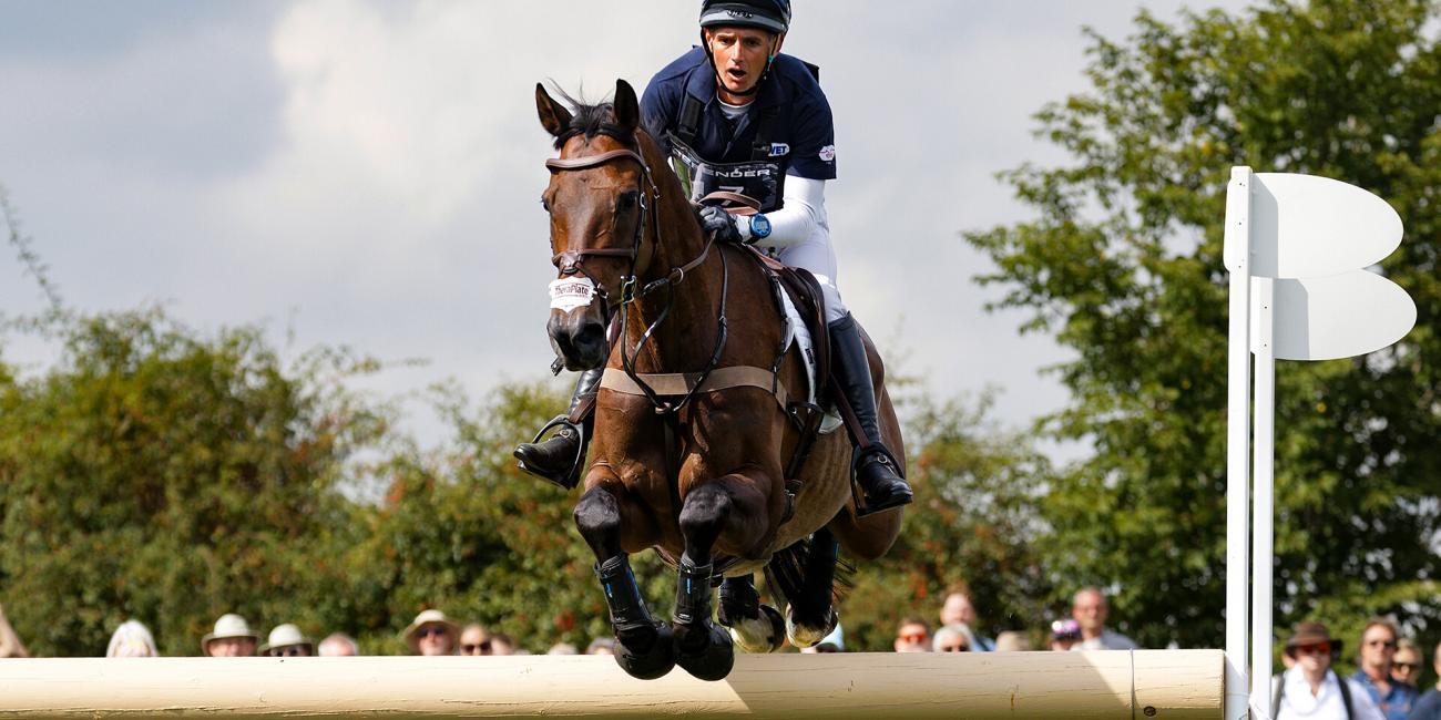 Andrew James & Celtic Morning Star jump Herbert's Hollow perfectly at the Land Rover Burghley Horse Trials 2022