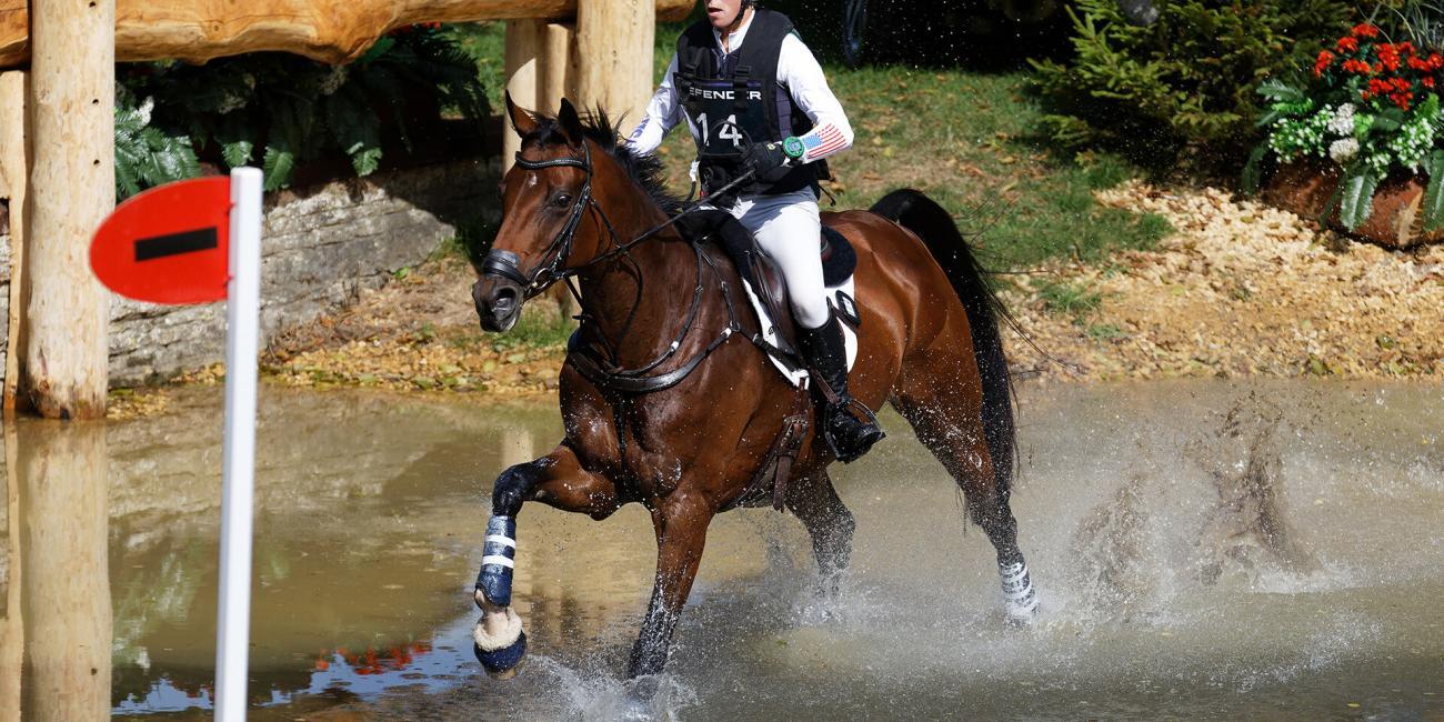 Cornelia Dorr & Daytona Beach in the water at The Trout Hatchery at the Land Rover Burghley Horse Trials 2022