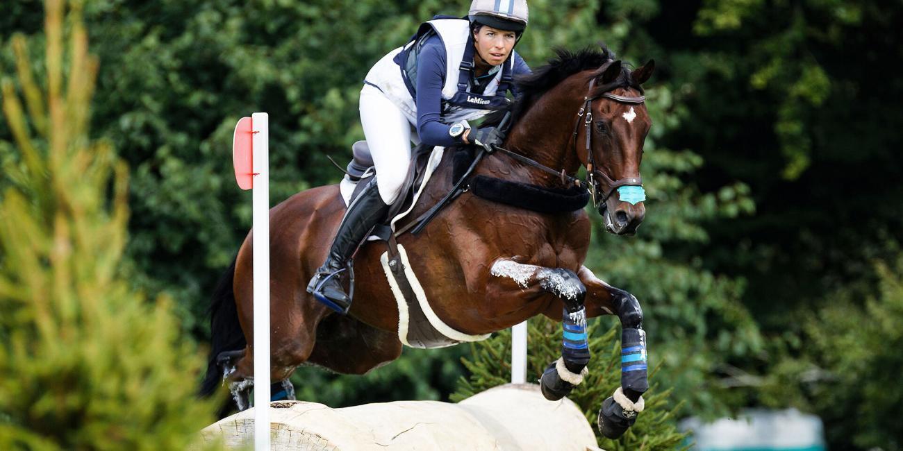 Meghan O'Donoghue sets her eyes on the next jump on Palm Crescent in Defender Valley at the Land Rover Burghley Horse Trials 2022