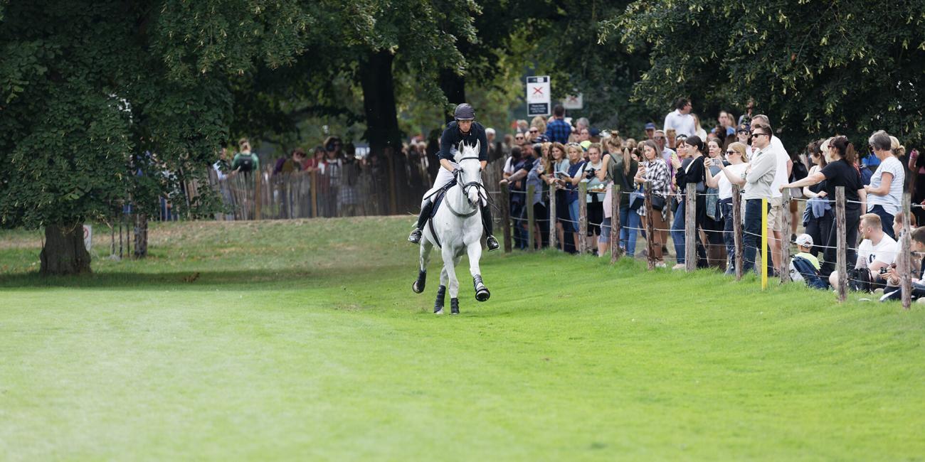Richard Jones & Alfies Clover approach the Oxer Over Ditch at Burghley Horse Trials 2022