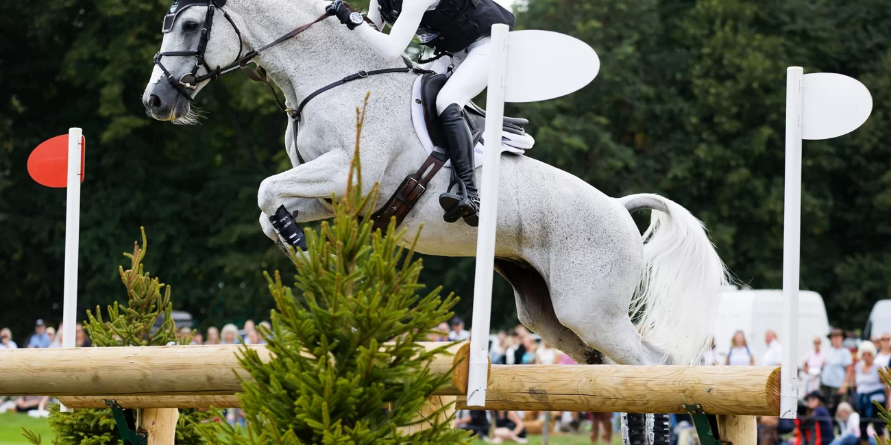 Emily Hamel & Corvett jump the Oxer Over Ditch at the 2022 Burghley Horse Trials