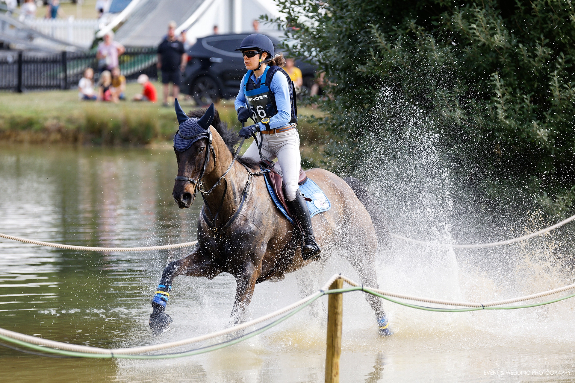 Sarah Clark & LV Balou Jeanz splash through the Boodles Raindance at the 2022 Burghley Horse Trials.