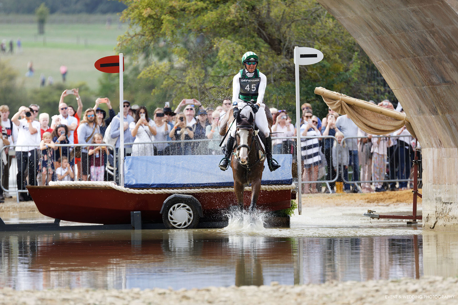 Michael Owen & Bradeley Law land in the water at Lion Bridge at the 2022 Burghley Horse Trials