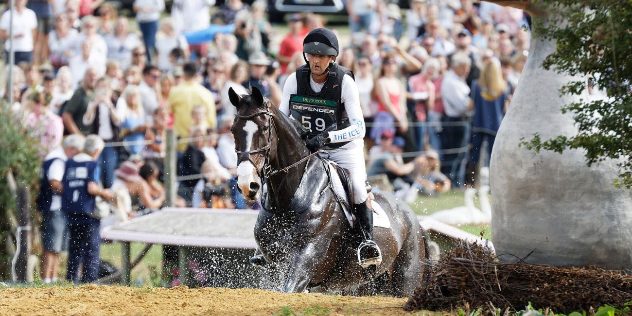 Phil Brown & Harry Robinson exit the water for the first time at The Boodles Raindance at the 2022 Burghley Horse Trials