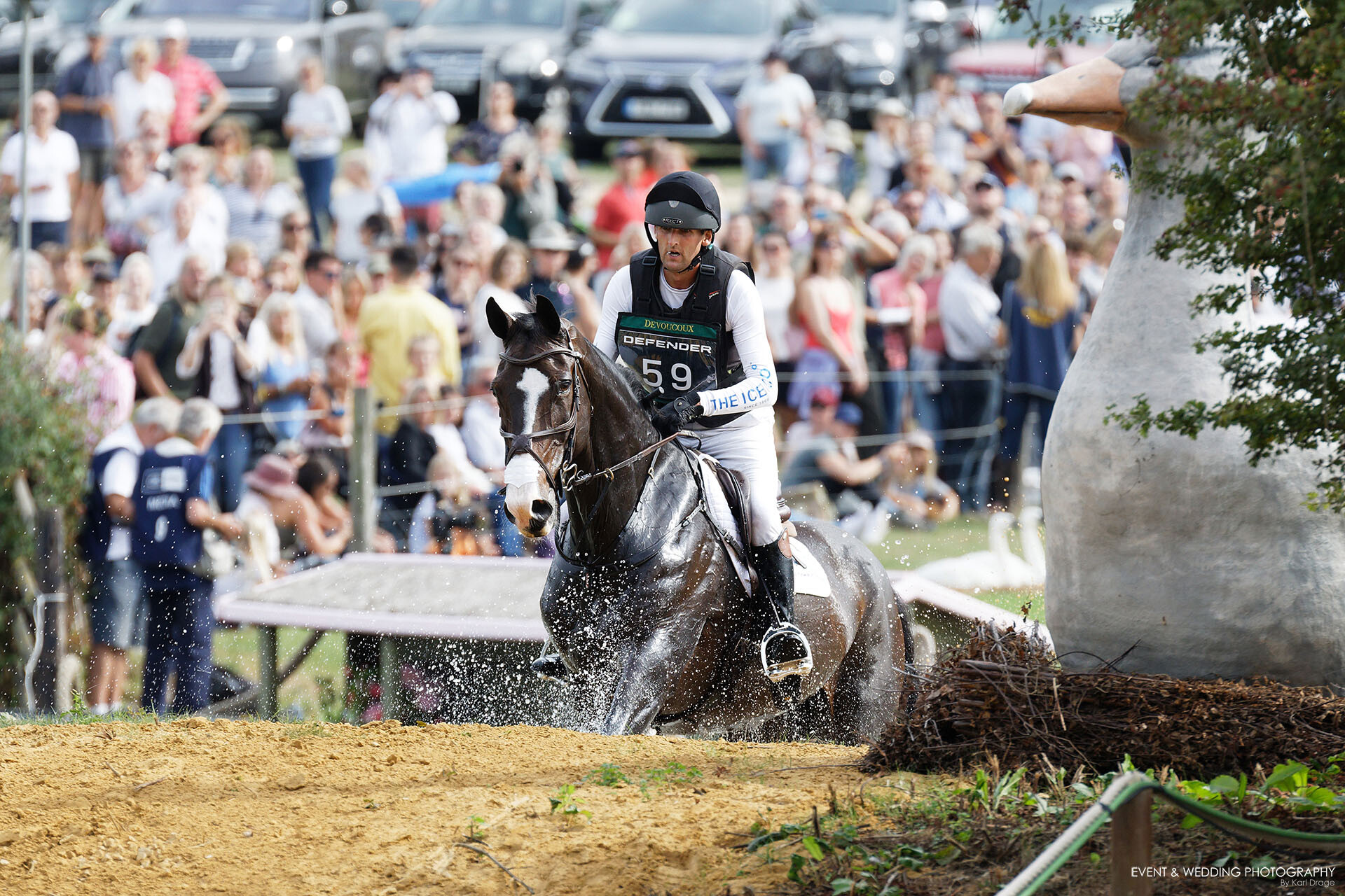 Phil Brown & Harry Robinson exit the water for the first time at The Boodles Raindance at the 2022 Burghley Horse Trials