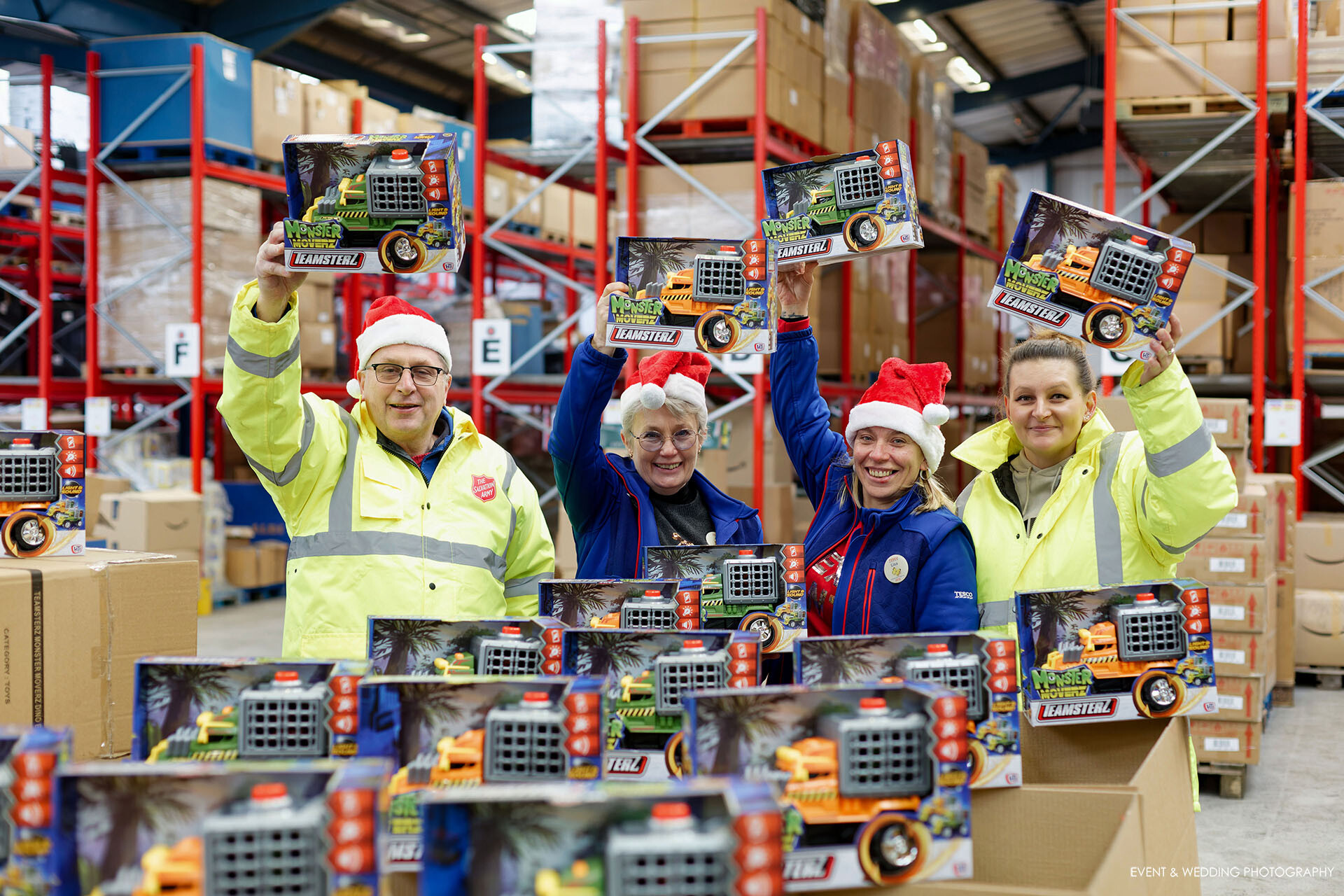 Tesco and Salvation Army staff pose with boxes of toys that Tesco donated to the Salvation Army's 2022 Christmas Present Appeal.